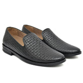 Country Maddox black leather slip-ons featuring a sleek design.